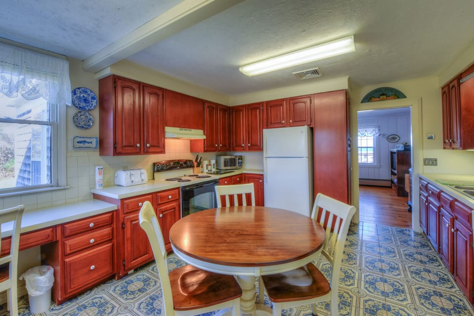 Fully functioning kitchen with seating.