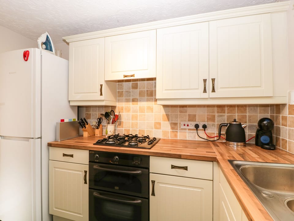 Fridge, electric kettle, toaster, cookware/dishes/utensils