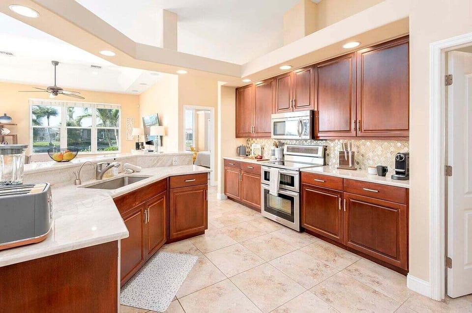 Kitchen Features Stainless Appliances, a Double Oven, Stove, Dishwasher and Fridge with Ice Maker