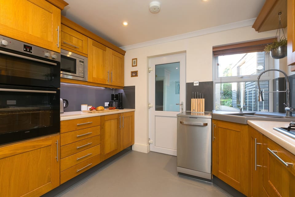 Fridge, electric kettle, toaster, cookware/dishes/utensils