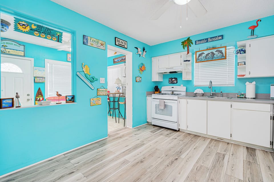 Kitchen includes openings to both the family room and Florida room