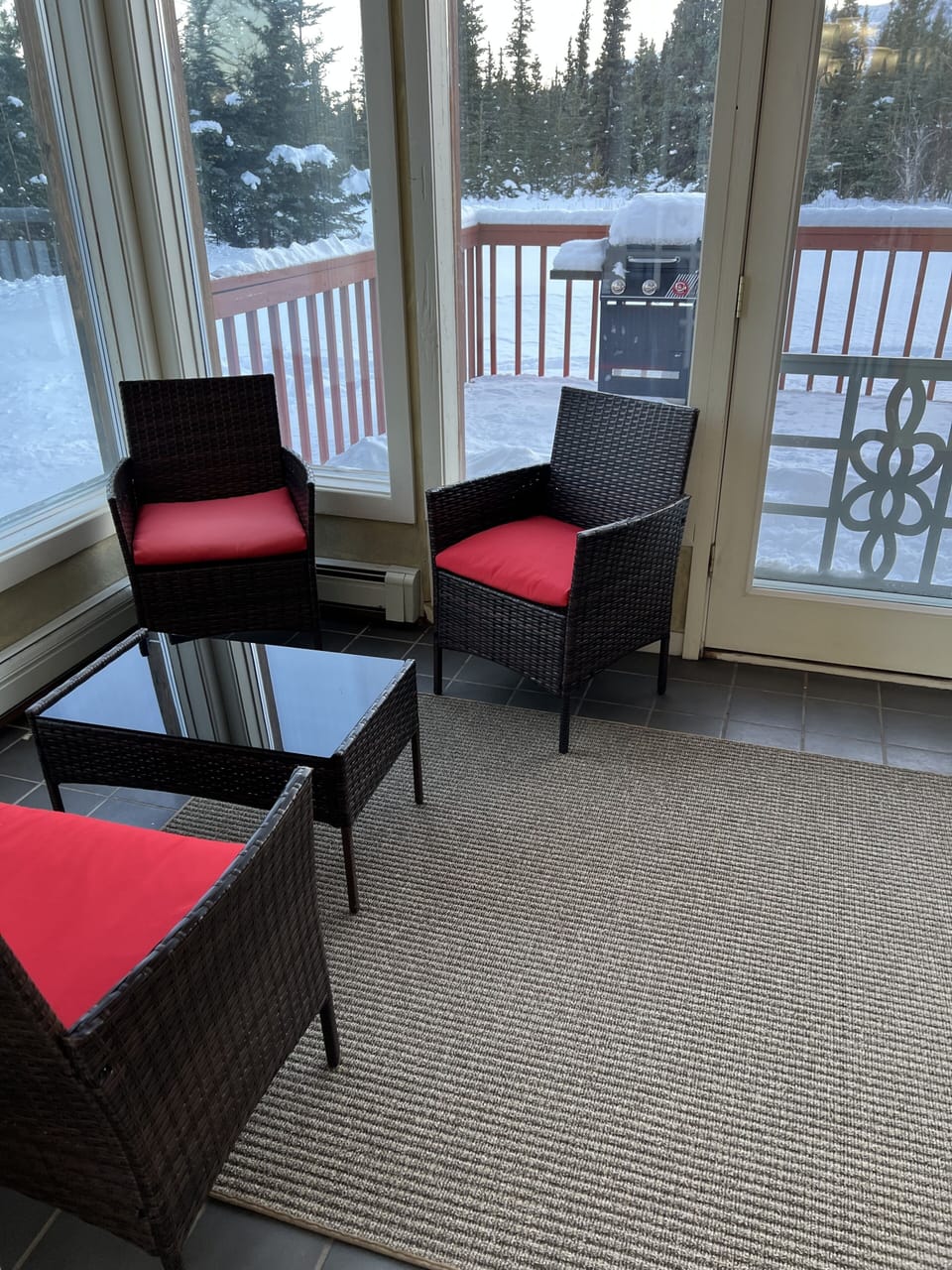Sun room has lots of space for reading and gathering.