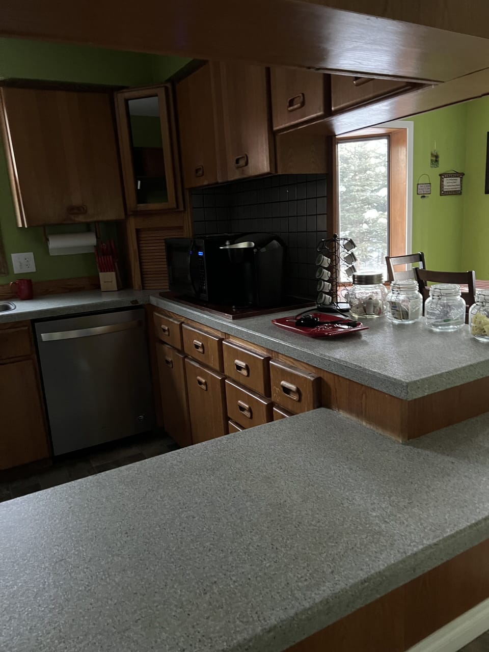 Kitchen is fully stocked with dishes and siverware, pot and pans, rice cooker...