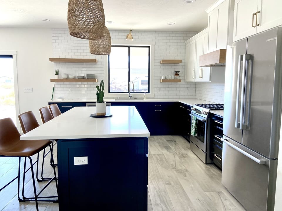 Kitchen is equipped with high end appliances and a gas stove.