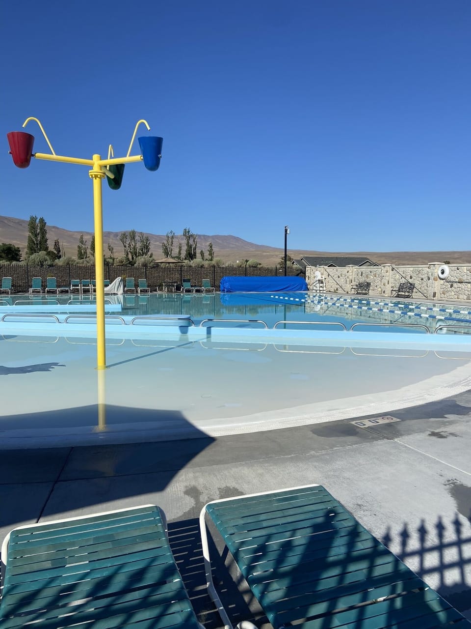Community pool has a shallow toddler play area for the little ones.