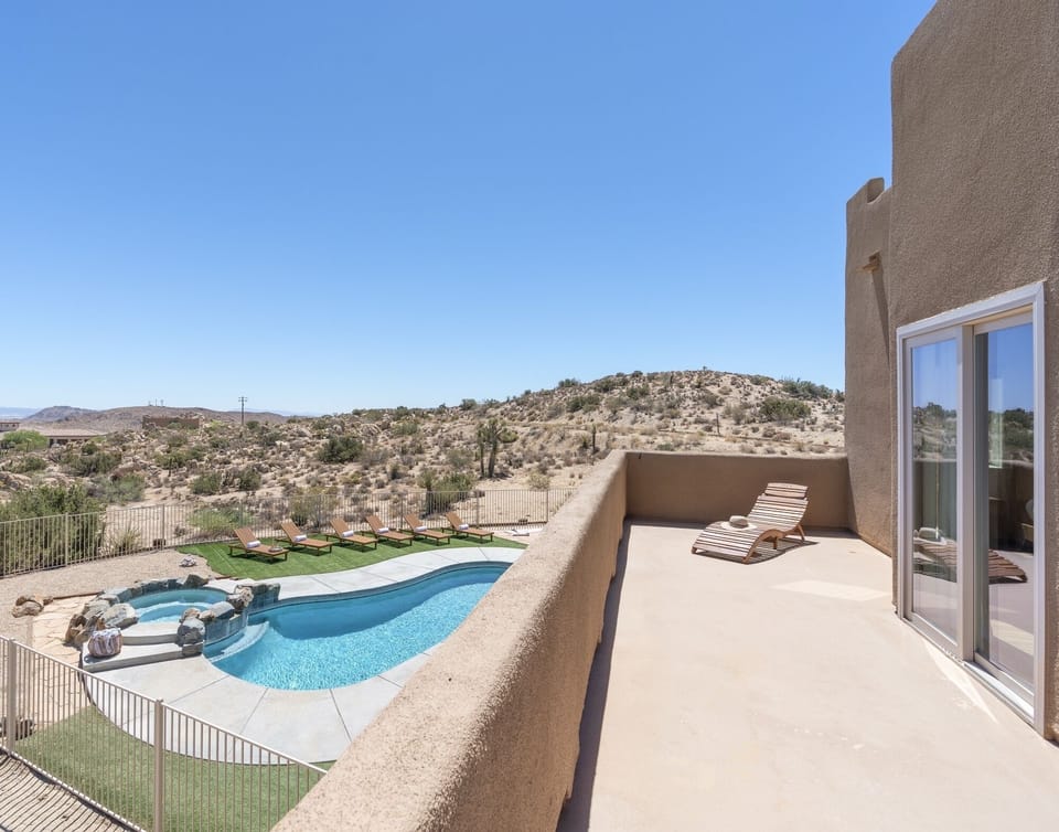 Master bedroom private balcony with  sun loungers and views