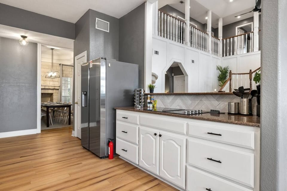 A double french door fridge provides plenty of space. Take advantage of the ice maker and blender to enjoy a margarita as you cook away on the 4-burner electric stovetop