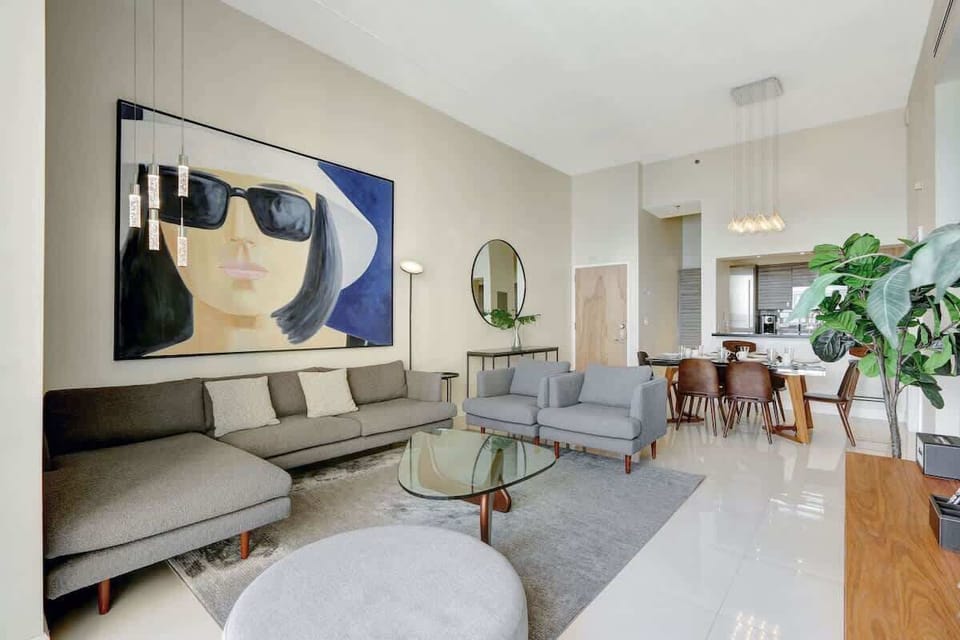 Spacious living room with a single size mattress and couch