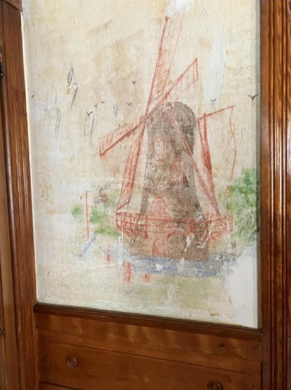 Original mural on living room wall shows windmill 