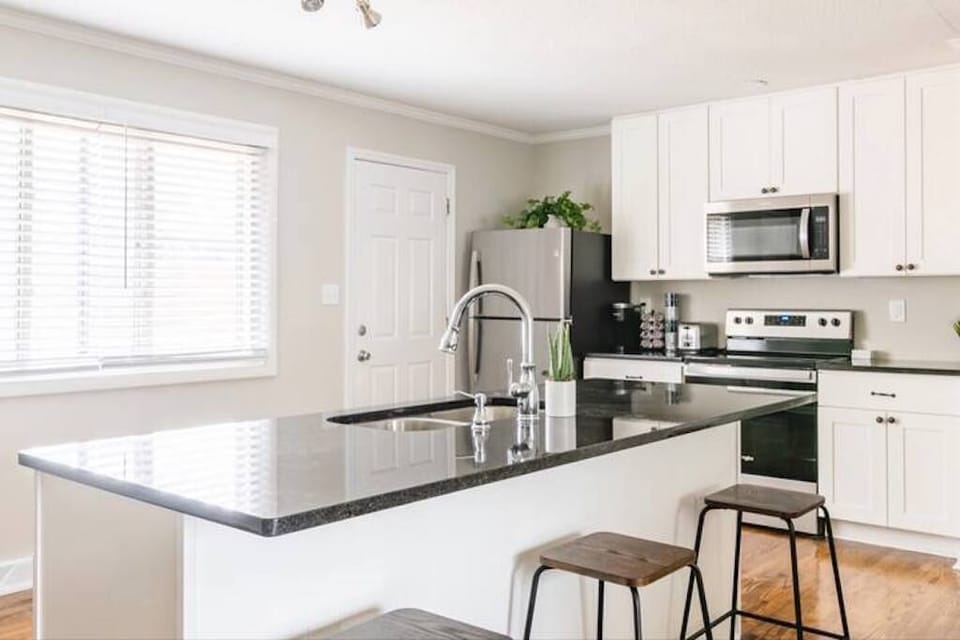 Enjoy cooking a meal & serving it on this LARGE kitchen island!