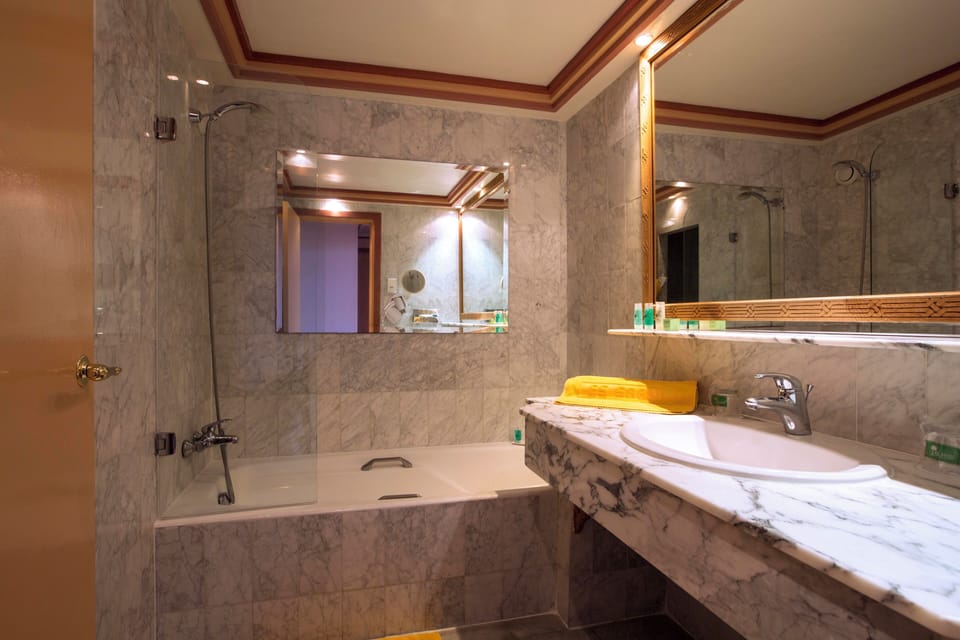 Combined shower/tub, free toiletries, hair dryer, bathrobes