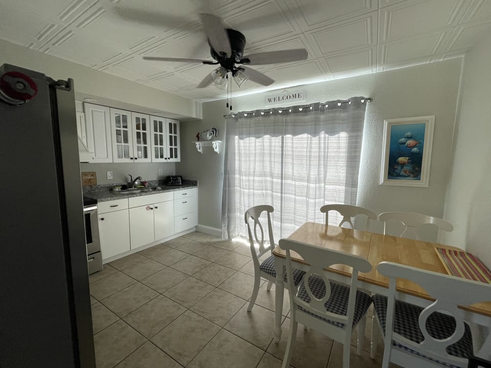 Eat in kitchen and sliders off to the fenced in backyard