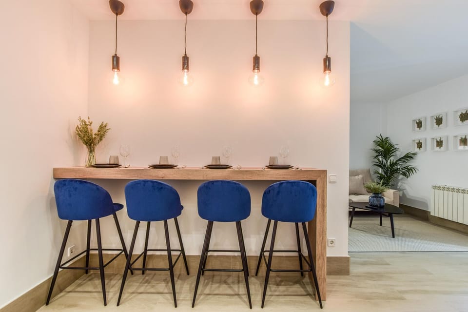 Main view of dining space with high table and stools