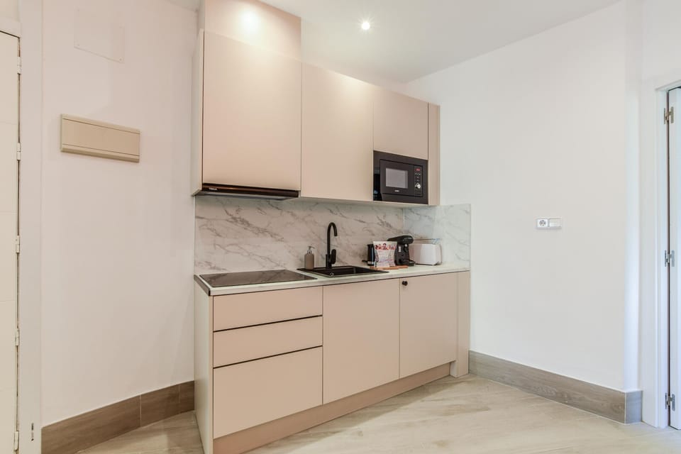 Main view of kitchen space with appliances