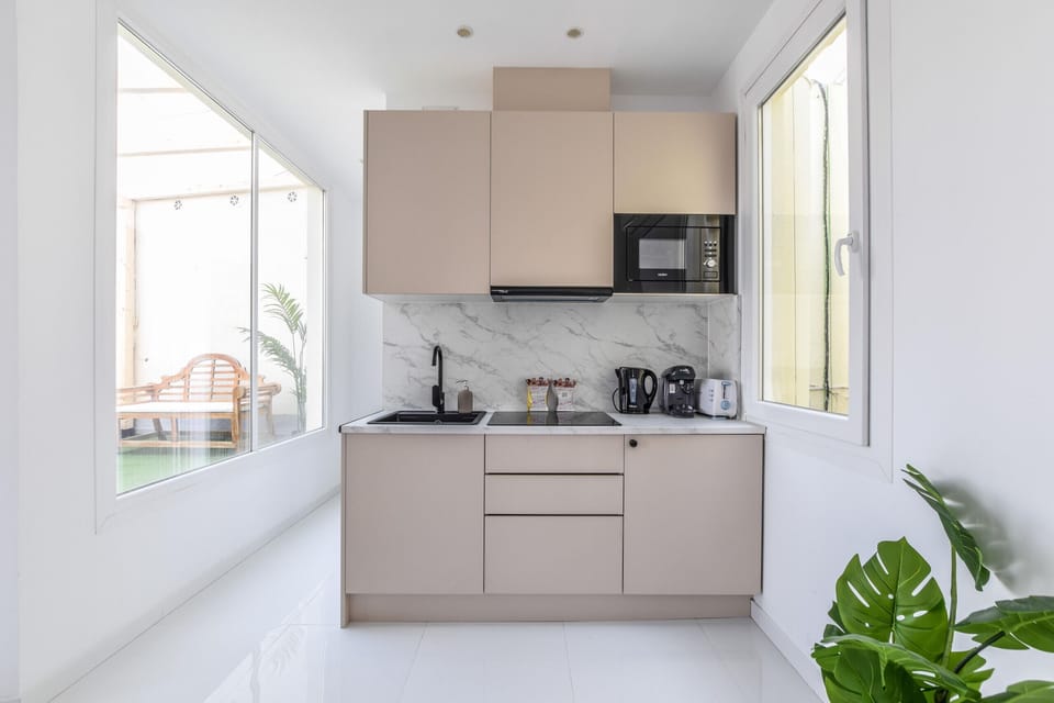 Main view of the kitchen space with appliances