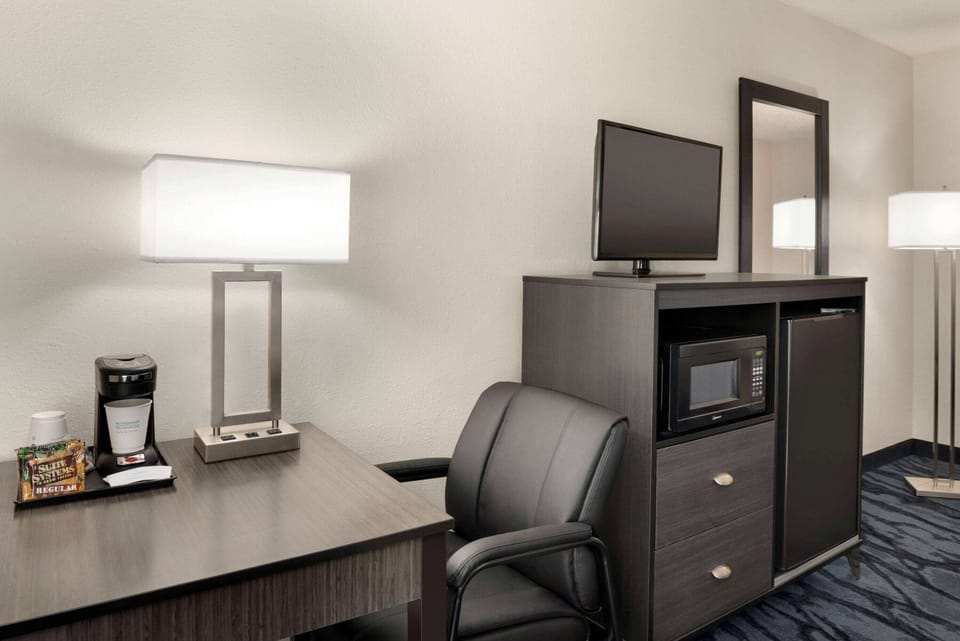 Desk, blackout drapes, iron/ironing board, free cribs/infant beds