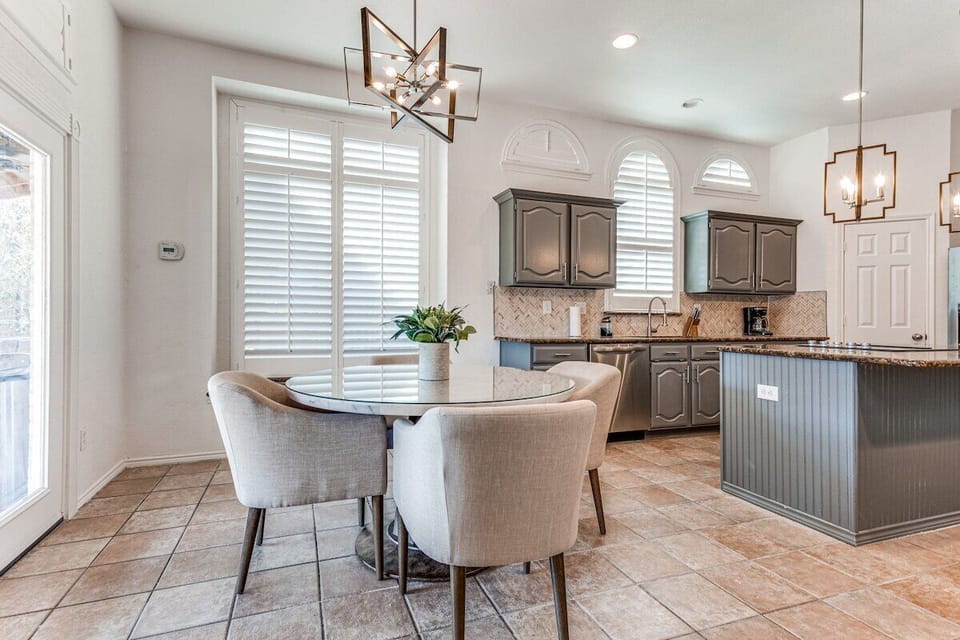 Breakfast nook with lots of natural light and doors that open up to the backyard