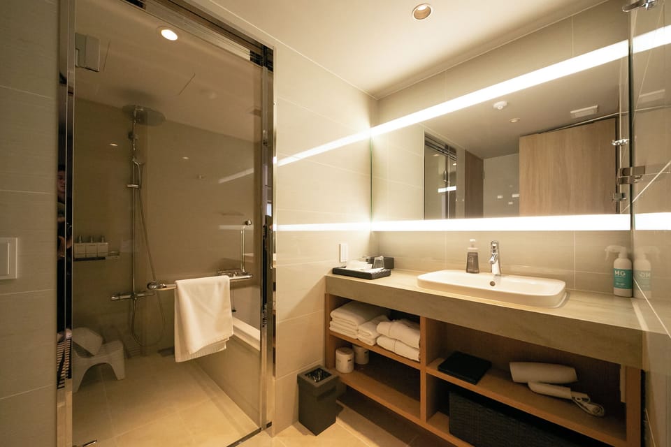 Deluxe Twin Room, Non Smoking (Up to 3 pax for above 6 yrs) | Bathroom | Shower, designer toiletries, hair dryer, slippers
