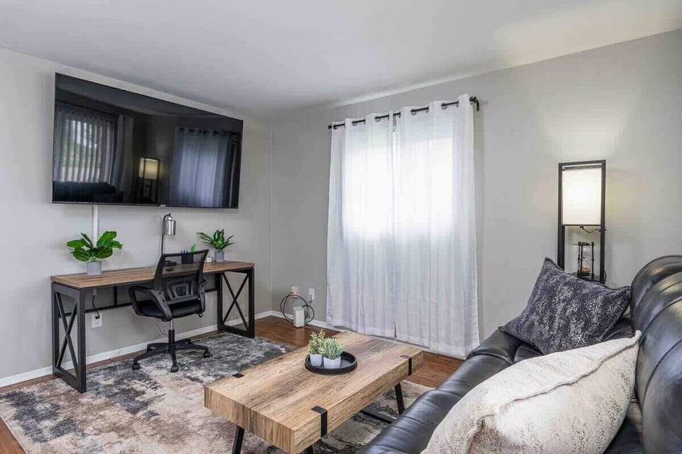 Living Room with very comfortable leather couch. 
75" Roku Smart tv!
Perfet work space!