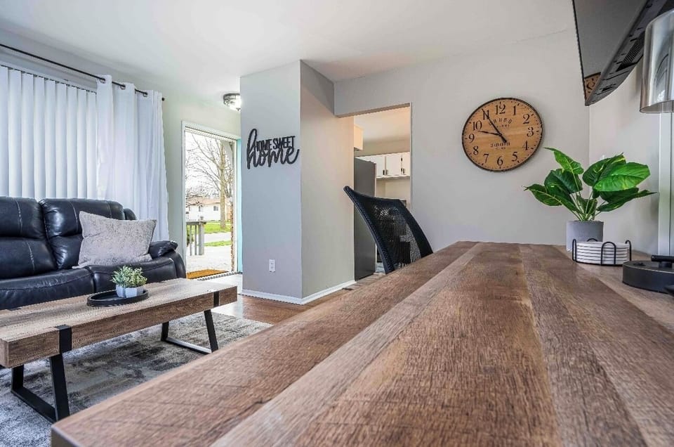 Front entrance to the house. 
Living room with workspace and 65" Roku Tv 