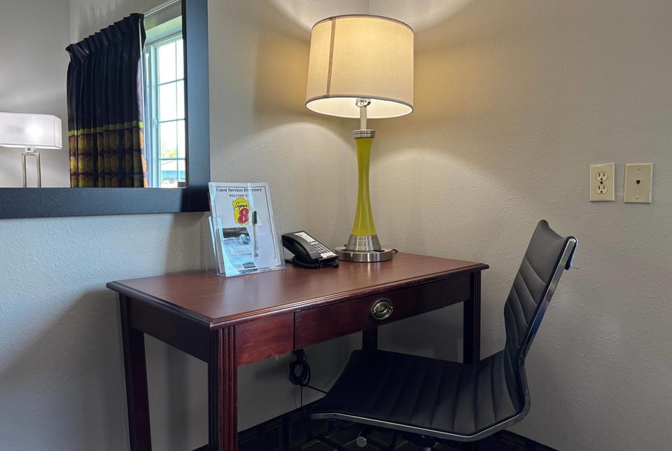 Desk, blackout drapes, iron/ironing board, free cribs/infant beds