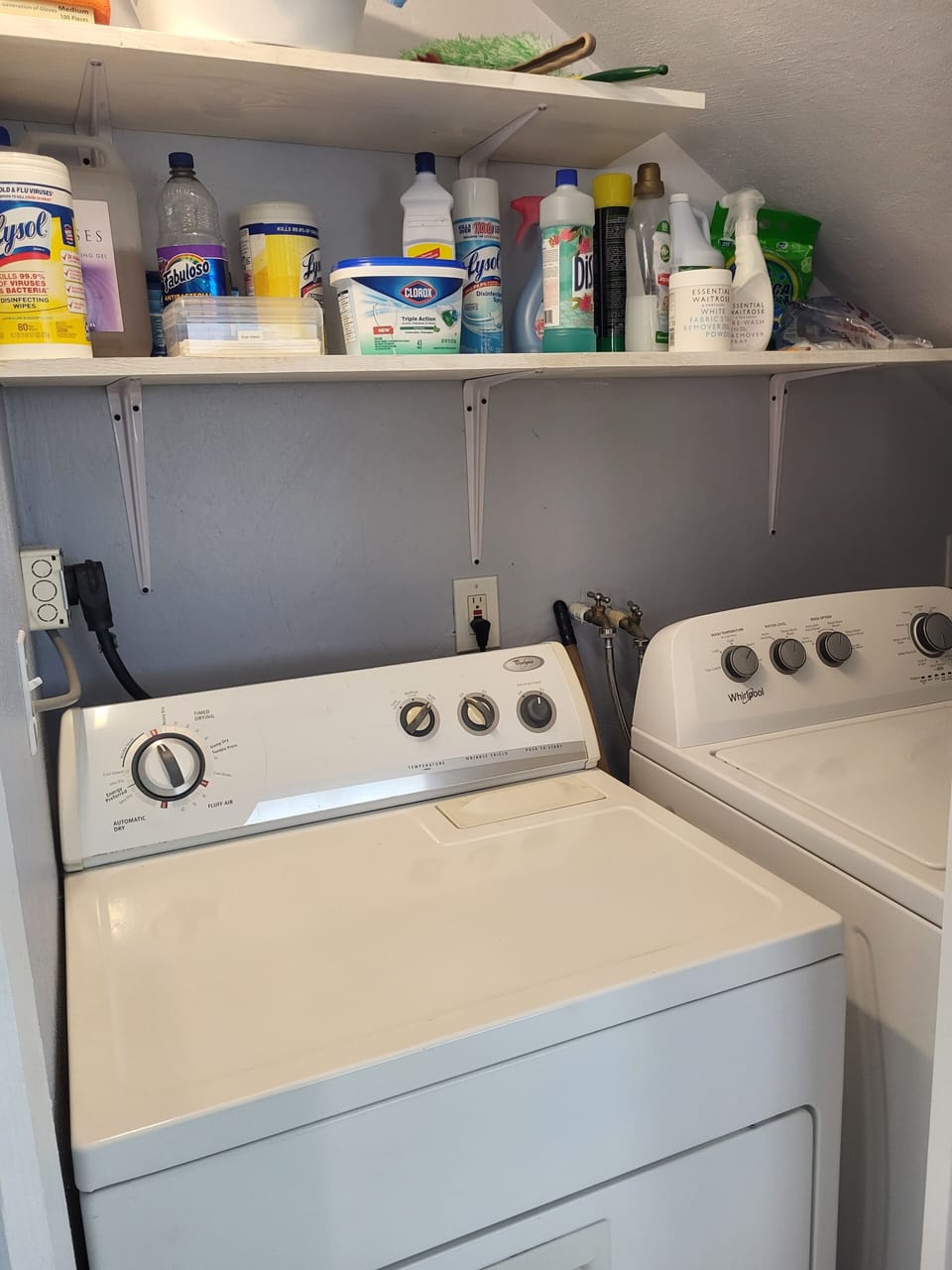 Laundry closet with washer, dryer and cleaning supplies