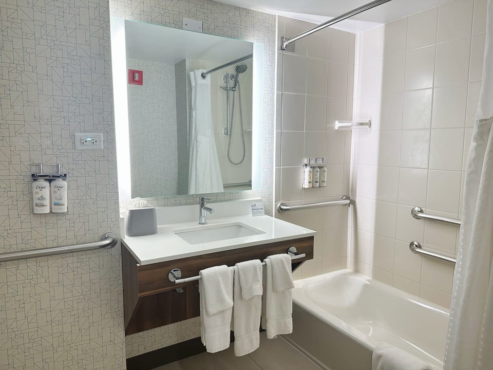 Combined shower/tub, hair dryer, towels, soap