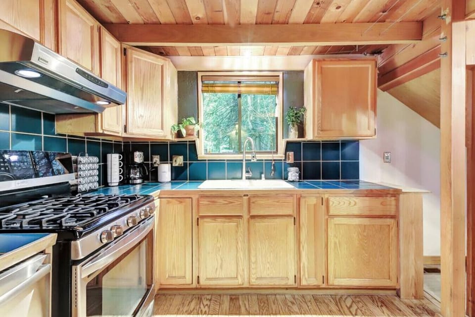 Gas stove, dish washer and coffee station.