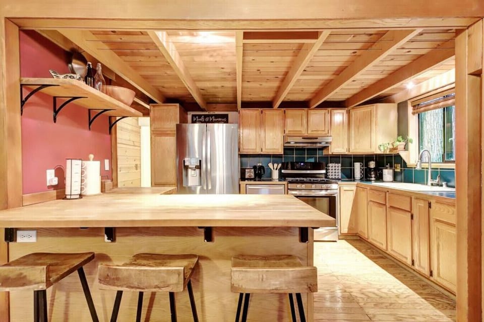 Quaint and cozy cabin kitchen with a gas stove and all everything you need to prepare a meal for friends and family.