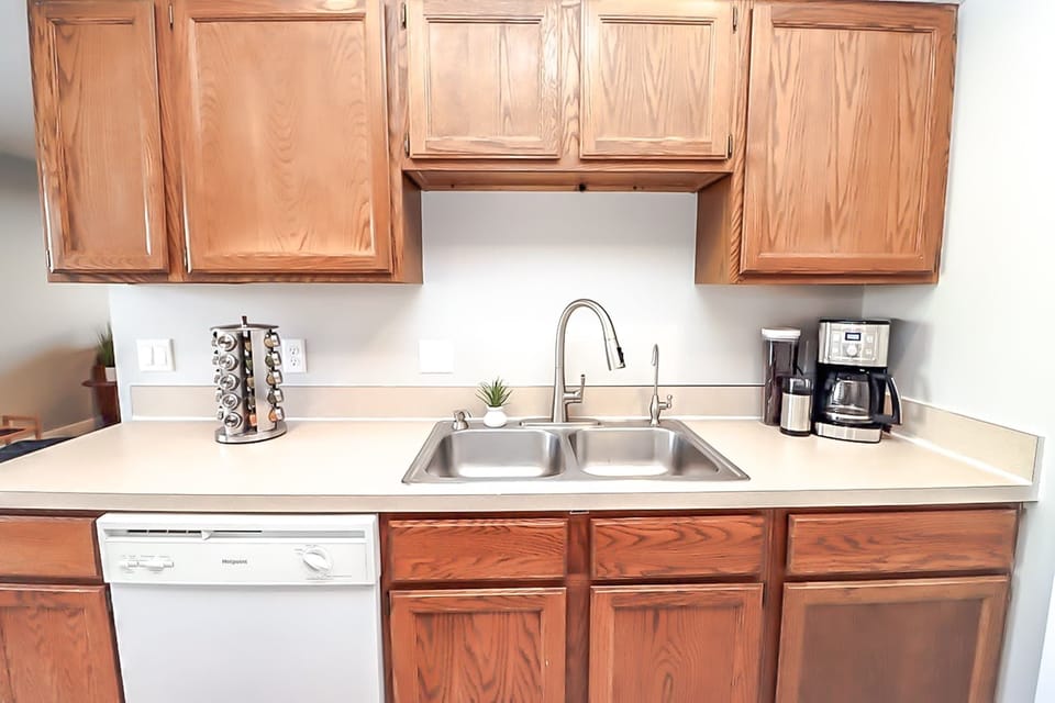 Double-sided sink and coffee are also present.