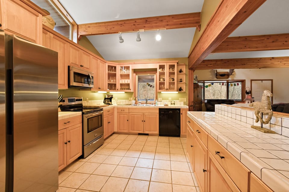 Large Kitchen Stainless Appliances and Tile Counter Tops