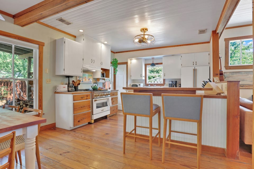 Kitchen area connected to dining area and living room