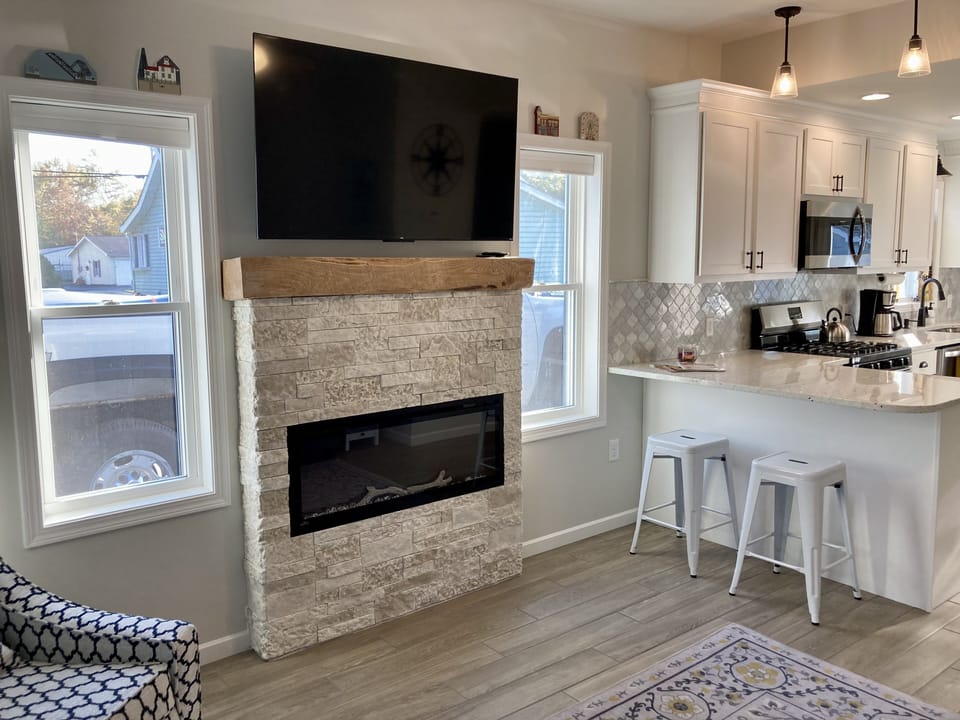 Living room with cozy electric fireplace and 55" smart TV