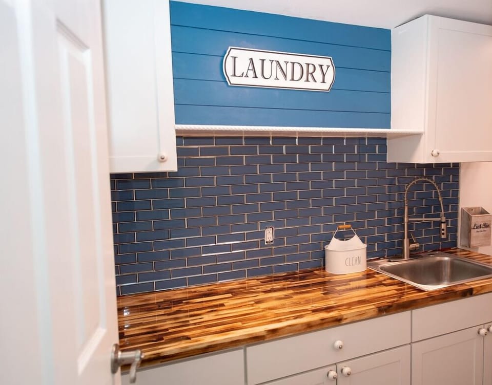 Laundry with sink and enough space to fold and or iron clothes