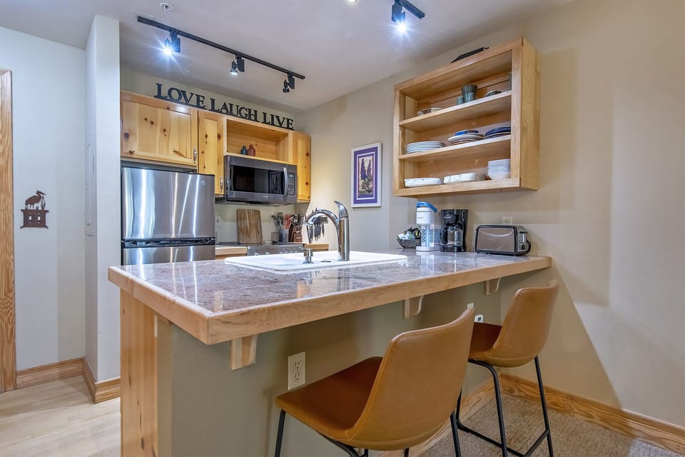 Compact yet mighty Kitchen is fully equipped and offers additional seating 