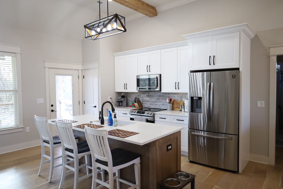 Full Kitchen.  Sits 3 at the counter.  Oven, stove, microwave and refrigerator.
