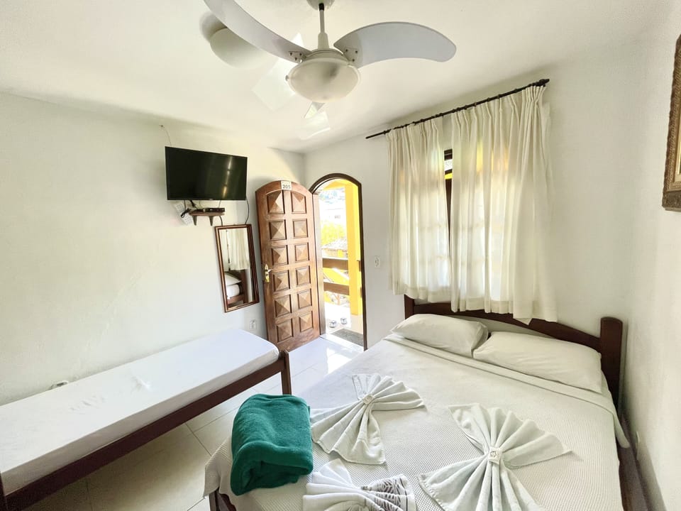Standard Triple Room, 1 Bedroom, Garden View | Free WiFi, bed sheets