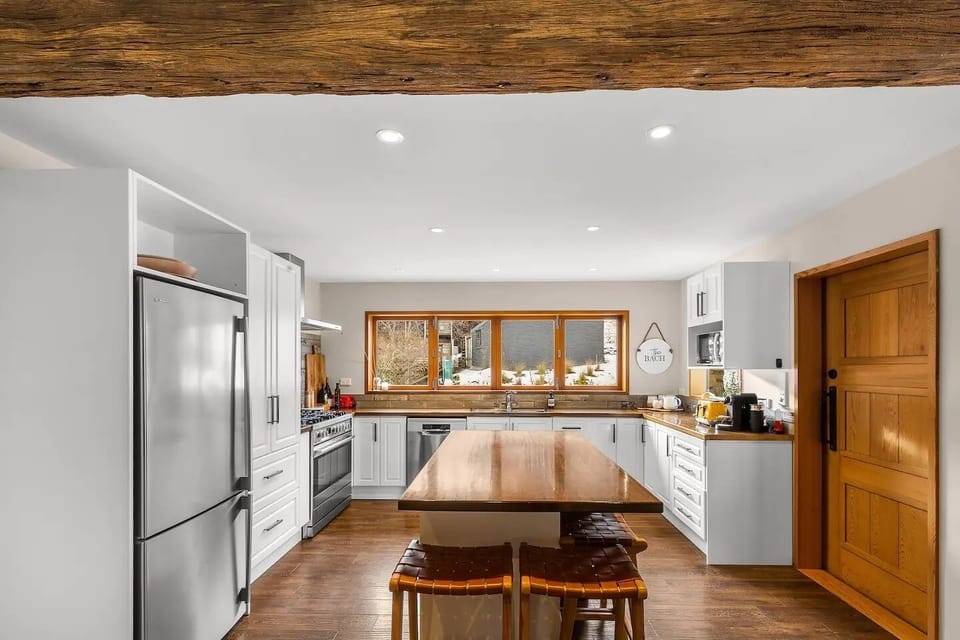 Large fully equipped kitchen overlooking the garden and kids play area