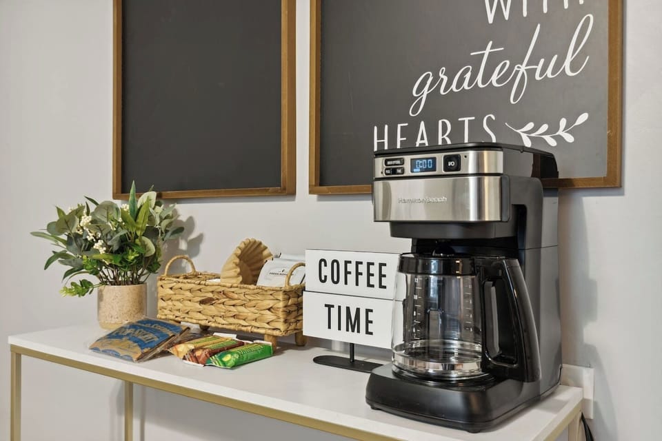 Enjoy the ease of making coffee or tea at this fully stocked refreshment station.
