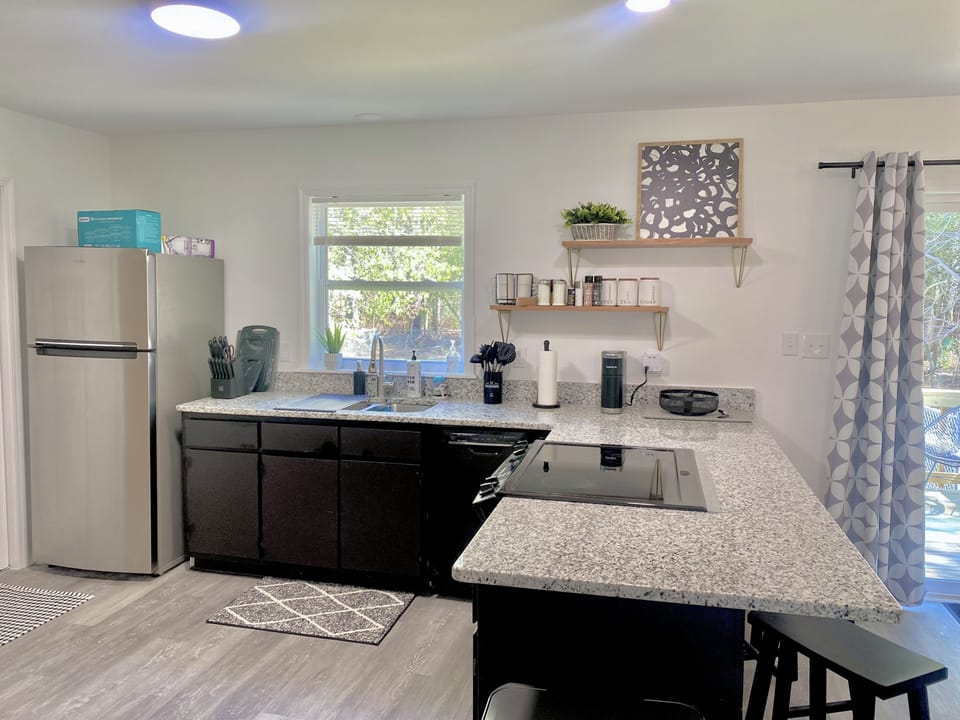Open kitchen seating for 8. Overlooking private deck and fenced backyard