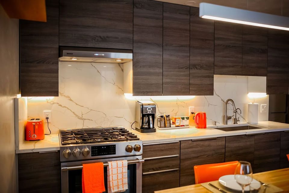 Kitchen with full size appliances, filtered water faucet, coffee and tea station