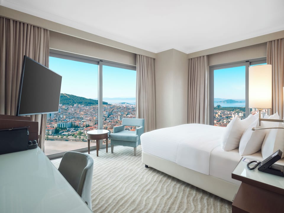 Suite, Multiple Beds, Sea View | Minibar, laptop workspace, blackout drapes, soundproofing