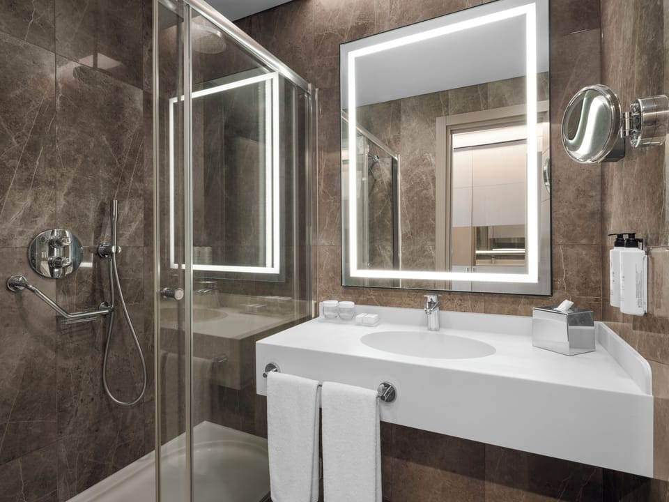 Shower, free toiletries, hair dryer, slippers