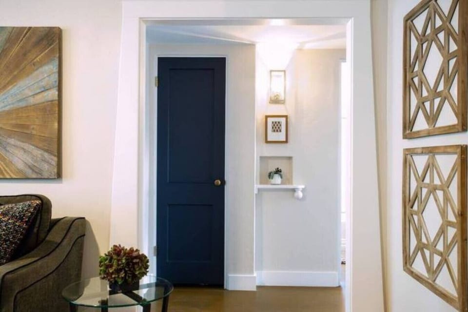 Clean hallway with simple decor that connects the main living spaces.