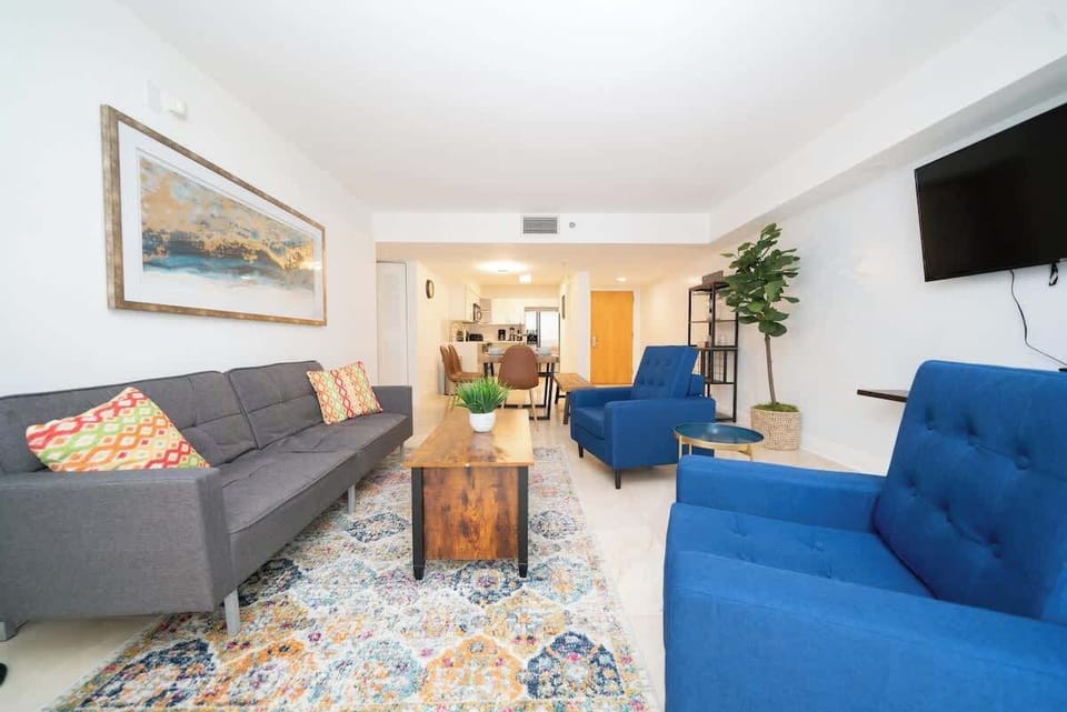 Modern open concept living space featuring a cozy sofa bed