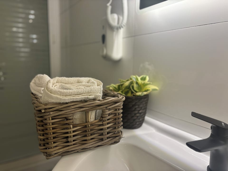 Comfort Room | Bathroom | Shower, rainfall showerhead, hair dryer, slippers
