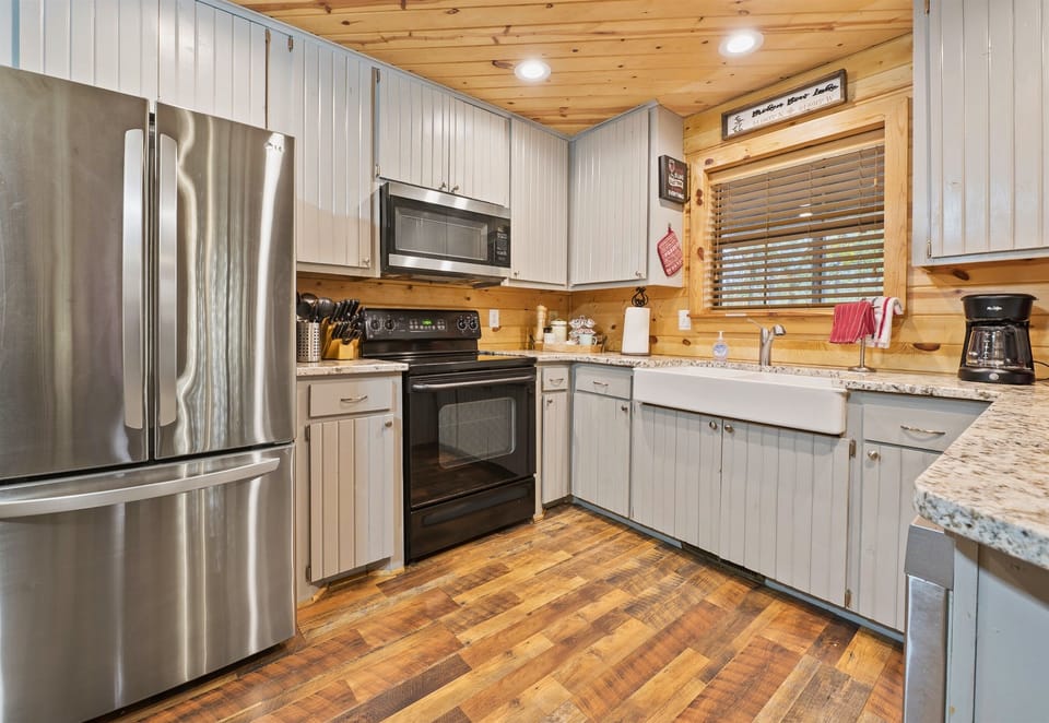 Whip up your favorite meals in this modern kitchen with sleek appliances and plenty of counter space.