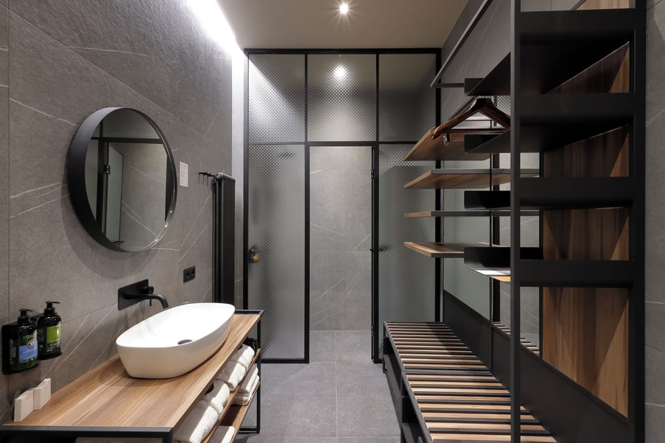 Shower, rainfall showerhead, designer toiletries, hair dryer