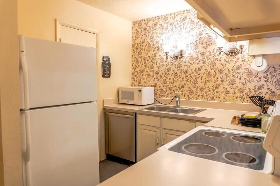 The fully equipped kitchen boasts ample cabinet and pantry space for storage, and all the basic cookware including a crockpot and blender to easily whip up some delicious meals at home.
