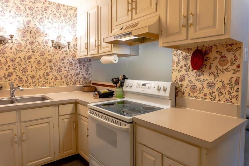 The fully equipped kitchen boasts ample cabinet and pantry space for storage, and all the basic cookware including a crockpot and blender to easily whip up some delicious meals at home.